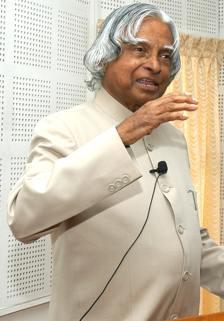 Portrait of IHRWO Secretary General, Indian woman in professional attire, warm office background, authoritative and approachable
